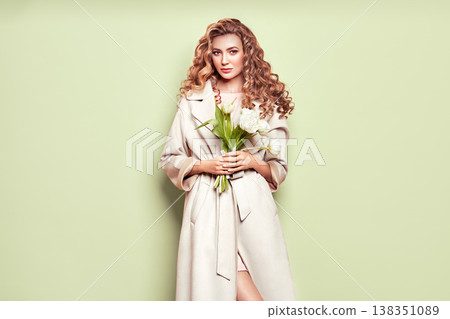 Young woman in white spring coat 138351089