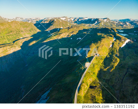Road with tunnel in mountains Norway. Aerial view. 138351192