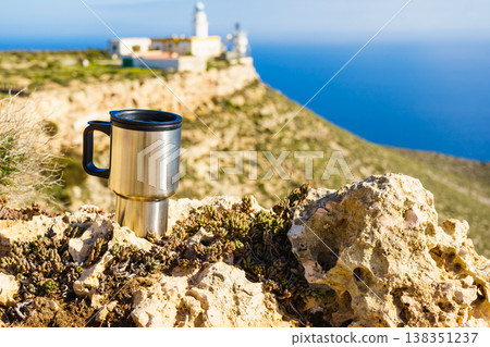 Thermal mug, thermos on nature. Travel outdoor picnic. Thermal mug, thermos on nature. Travel outdoor picnic. 138351237