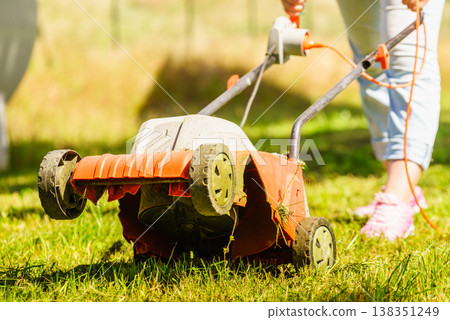 Gardening. Mowing lawn with lawnmower Gardening. Mowing lawn with lawnmower 138351249