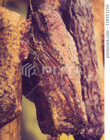 Smoked sausages meat hanging in smokehouse 138351250