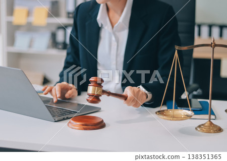 Lawyer explained to the client about the law that must be brought against the court case. Lawyer explained to the client about the law that must be brought against the court case. 138351365