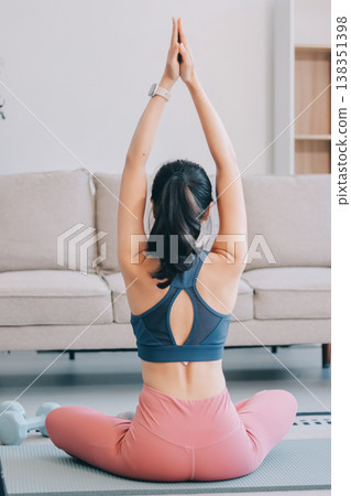 Young Asian sporty attractive people practicing yoga lesson with instructor. Asia group of women exercising healthy lifestyle in fitness studio. Sport activity, gymnastics or ballet dancing class. Young Asian sporty attractive people practicing yoga lesson with instructor. Asia group of women exercising healthy lifestyle in fitness studio. Sport activity, gymnastics or ballet dancing class. 138351398