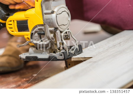 Person cutting floor panels Person cutting floor panels 138351457