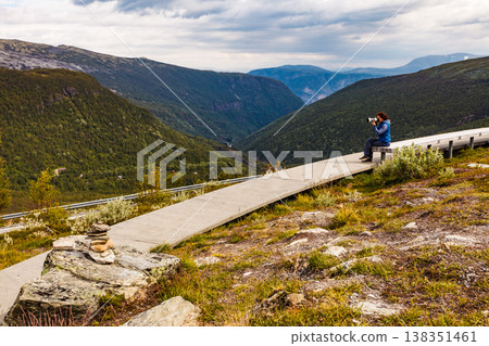 Woman on Vedahaugane rest stop, Norway Woman on Vedahaugane rest stop, Norway 138351461