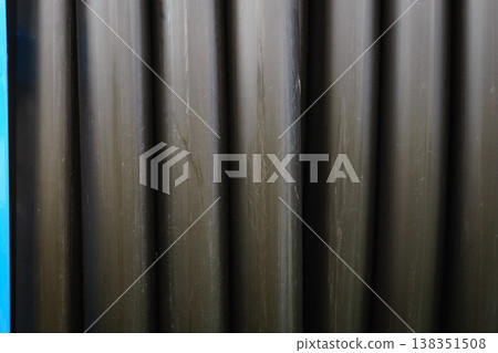 Rolled up of black irrigation hose Rolled up of black irrigation hose 138351508