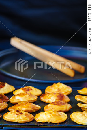 Pieces of cheese on grill Pieces of cheese on grill 138351516
