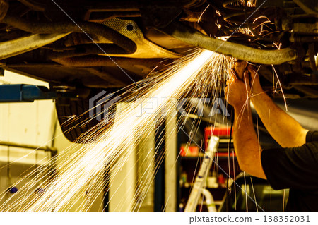 Mechanic grinding car body by grinder Mechanic grinding car body by grinder 138352031