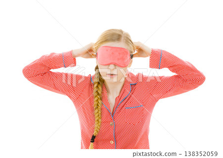 Sleepy woman wearing pink eye band Sleepy woman wearing pink eye band 138352059