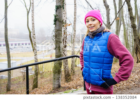 Teenage sporty girl listening to music outdoor. Teenage sporty girl listening to music outdoor. 138352084