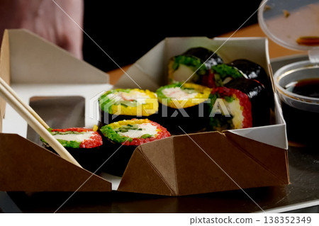 Rolls delivered in a cardboard box. Rice Rolls delivered in a cardboard box. Rice 138352349