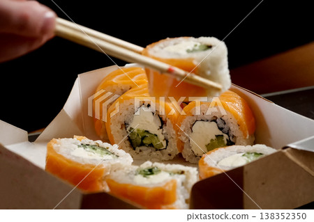 Rolls delivered in a cardboard box. Rice Rolls delivered in a cardboard box. Rice 138352350