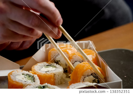 Rolls delivered in a cardboard box. Rice Rolls delivered in a cardboard box. Rice 138352351