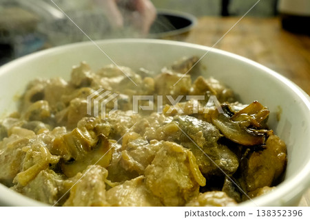 Fried pieces of chicken with mushrooms, in milk in a cup Fried pieces of chicken with mushrooms, in milk in a cup 138352396