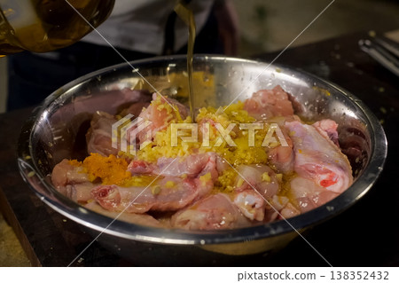pour chicken meat with sunflower oil. meat pour chicken meat with sunflower oil. meat 138352432