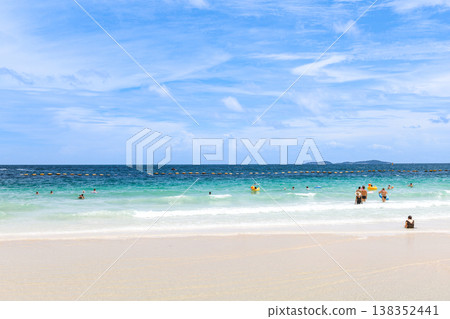 A beach under a clear blue sky 138352441