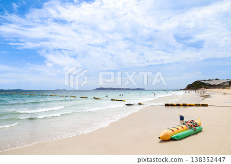 A beach under a clear blue sky 138352447