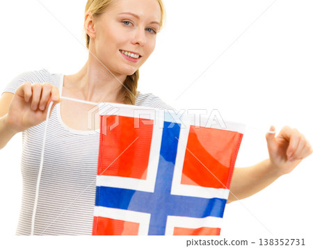 Girl holding norwegian flag Girl holding norwegian flag 138352731