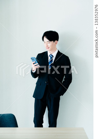 A young businessman calling in the office A young businessman calling in the office 138352976