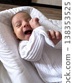 Smiling newborn baby on soft white pillow at home 138353525