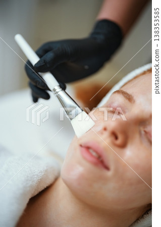 Woman receives facial treatment at a spa during a relaxing afternoon Woman receives facial treatment at a spa during a relaxing afternoon 138353585