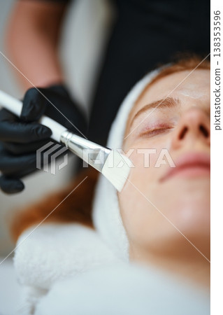 Woman receiving facial treatment at a spa during daytime Woman receiving facial treatment at a spa during daytime 138353596