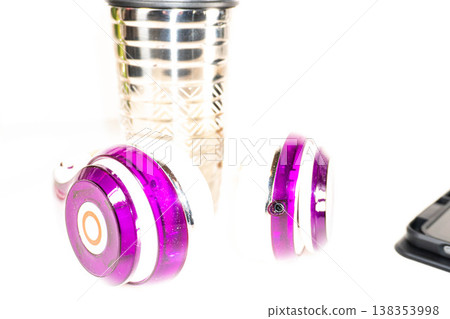 Hearing aids surround a metal container Hearing aids surround a metal container 138353998