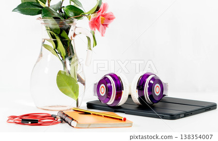 Purple headphones on a table 138354007