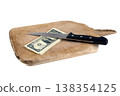 US dollar banknotes and a kitchen knife on a wooden chopping board 138354125