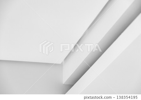 Minimal white architectural ceiling detail featuring intersecting planes, soft shadows 138354195