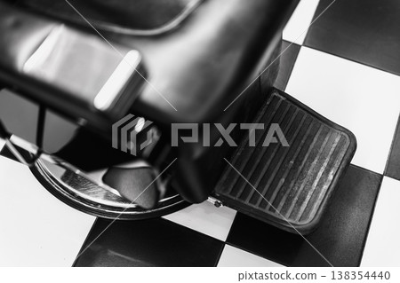 Vintage Barber Chair. Black And White Vintage Aesthetic With Industrial Elements And Rubber Padding 138354440