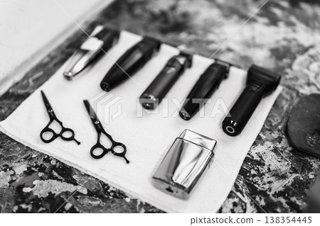 Barber Equipment Arranged Neatly. Stylish Hairdressing Setup Featuring All Essential Tools For Haircut Barber Equipment Arranged Neatly. Stylish Hairdressing Setup Featuring All Essential Tools For Haircut 138354445