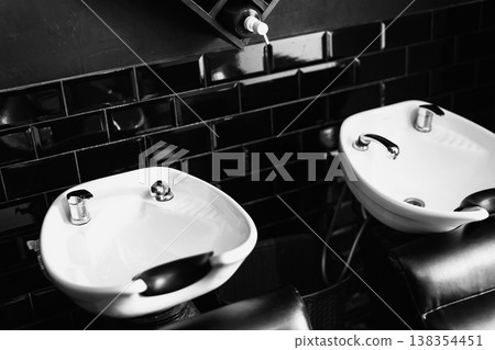 Elegant Porcelain And Chrome Sinks. Professional Grooming Area With Polished Sinks And Sleek Tiles 138354451
