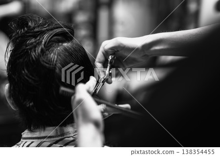 Barber Shaping Hair With Tools. Professional Barber Meticulously Designing Traditional Haircut Details Barber Shaping Hair With Tools. Professional Barber Meticulously Designing Traditional Haircut Details 138354455