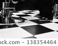 Sophisticated Vintage Commercial Space Showcasing Distinctive Checkered Pattern And Reflective Surfaces 138354464