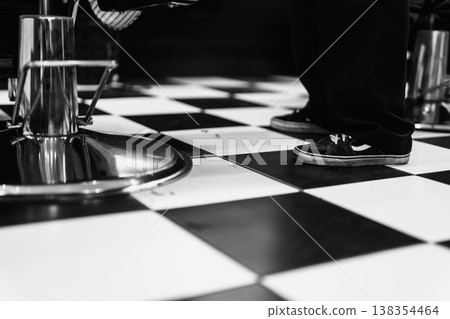 Sophisticated Vintage Commercial Space Showcasing Distinctive Checkered Pattern And Reflective Surfaces 138354464