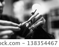Precise Grooming Skills. Skillful Barber Shaping Hair. Closeup Of Barber Using Scissors Carefully 138354467