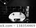 Stylish Wash Station With Glossy Porcelain Basin And Sleek Chrome Fixtures In Modern Salon Setting 138354469