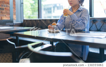Drinking dessert at a cafe Drinking dessert at a cafe 138355061