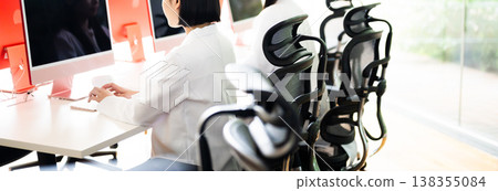 A woman is working on a PC 138355084