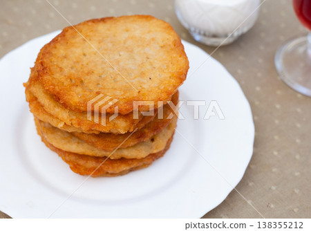Stacked Draniki on White Plate. Stacked Draniki on White Plate. 138355212