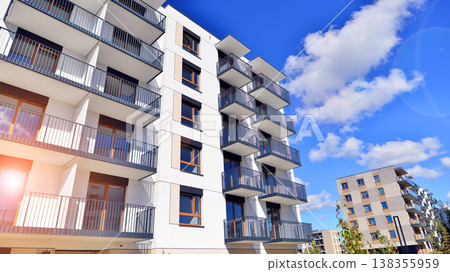 Apartments in residential complex. Housing structure at modern house.  Architecture for property investment. and architecture details. Urban abstract - windows of apartment building. 138355959
