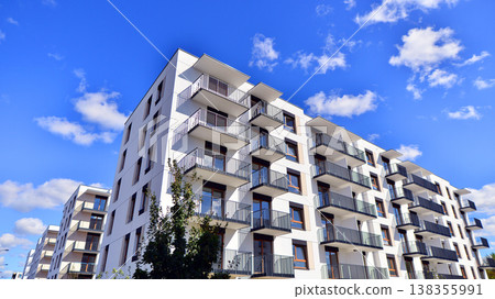 Apartments in residential complex. Housing structure at modern house. Architecture for property investment. and architecture details. Urban abstract - windows of apartment building. Apartments in residential complex. Housing structure at modern house. Architecture for property investment. and architecture details. Urban abstract - windows of apartment building. 138355991