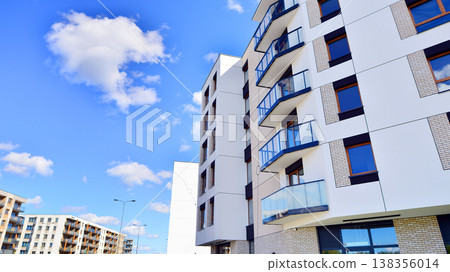 Apartments in residential complex. Housing structure at modern house. Architecture for property investment. and architecture details. Urban abstract - windows of apartment building. Apartments in residential complex. Housing structure at modern house. Architecture for property investment. and architecture details. Urban abstract - windows of apartment building. 138356014