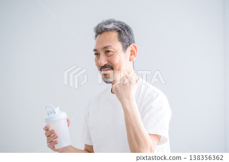 Japanese man with protein powder in his room Japanese man with protein powder in his room 138356362