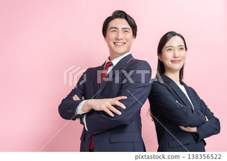 Businessmen and women with their arms crossed Businessmen and women with their arms crossed 138356522