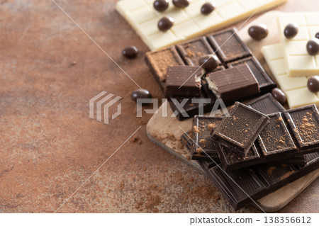 Assortment of white, milk and dark chocolate pieces Assortment of white, milk and dark chocolate pieces 138356612