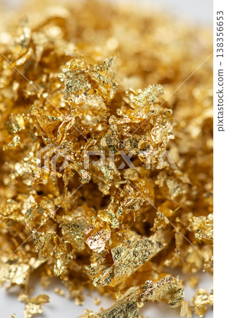 Piles of gold bars and gold dust. Piles of gold leaf. 138356653