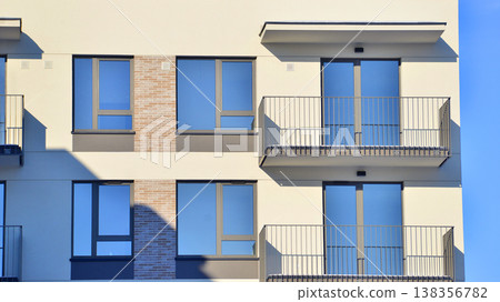 Apartments in residential complex. Housing structure at modern house.  Architecture for property investment. and architecture details. Urban abstract - windows of apartment building. 138356782