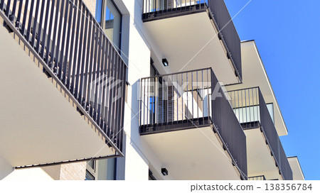 Apartments in residential complex. Housing structure at modern house.  Architecture for property investment. and architecture details. Urban abstract - windows of apartment building. 138356784